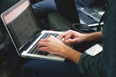 Someone working on a laptop